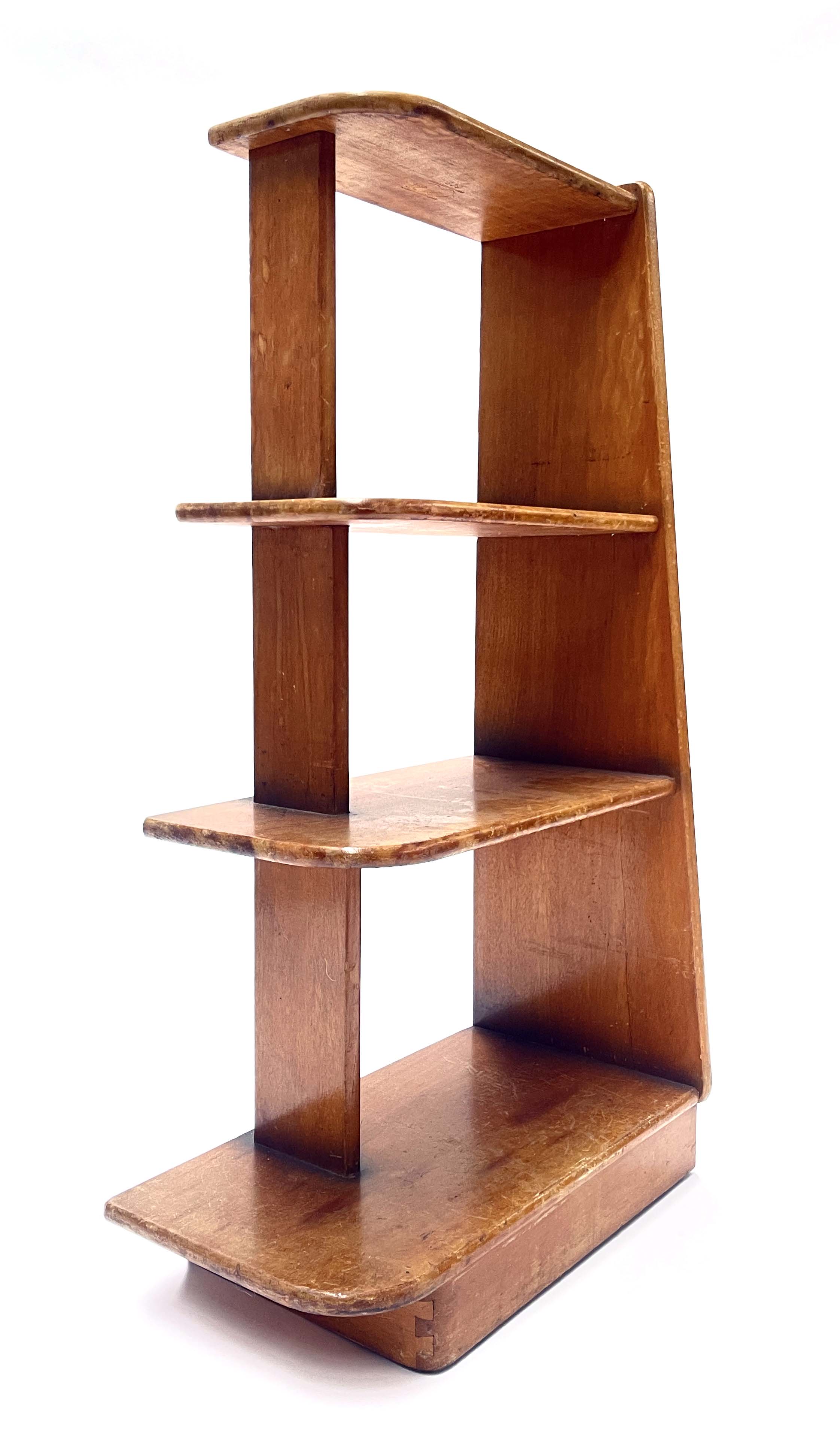 A set of Art Deco Czech freestanding shelves, circa 1930, four graduated tiers with curved open