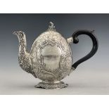 A German silver teapot, GGH, circa 1890, egg form, engraved with pebble design, embossed Rococo