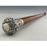 A 19th century white metal topped malacca walking cane, the pommel end embossed and chased with