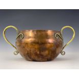A S Dixon for Birmingham Guild of Handicraft, an Arts and Crafts copper and brass twin handled bowl