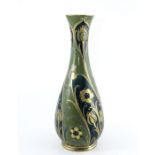 William Moorcroft for James MacIntyre, a large green and gold Florian vase