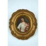 A late 19th Century oval KPM convex plaque, painted with a portrait of a young lady, half length