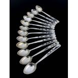 A set of 12 niello white metal spoons