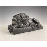 An Italian green marble model of a Medici lion, late 19th Century, modelled recumbent on a plinth,