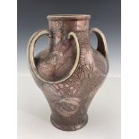 Art Nouveau Boch Freres Keramic vase, four handled embossed baluster form, painted in bronze
