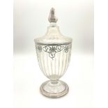 A clear glass bon-bon jar and cover, early 20th Century, of Neoclassical urn design, silver overlaid