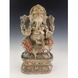 An Indian carved figure of Ganesha, painted in multiple colours on white ground, 38cm high