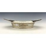 A George V silver fretwork bowl, Barker Brothers, Chester 1917, pierced boat form, reeded and