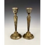 A large pair of Elizabeth II silver candlesticks, A T Cannon, Birmingham 1974