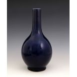 A Chinese blue monochrome glaze bottle vase, 18th Century, extended neck, bombe body, celadon