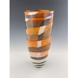 A contemporary studio glass vase, cylindrical form, decorated with brown, black and white