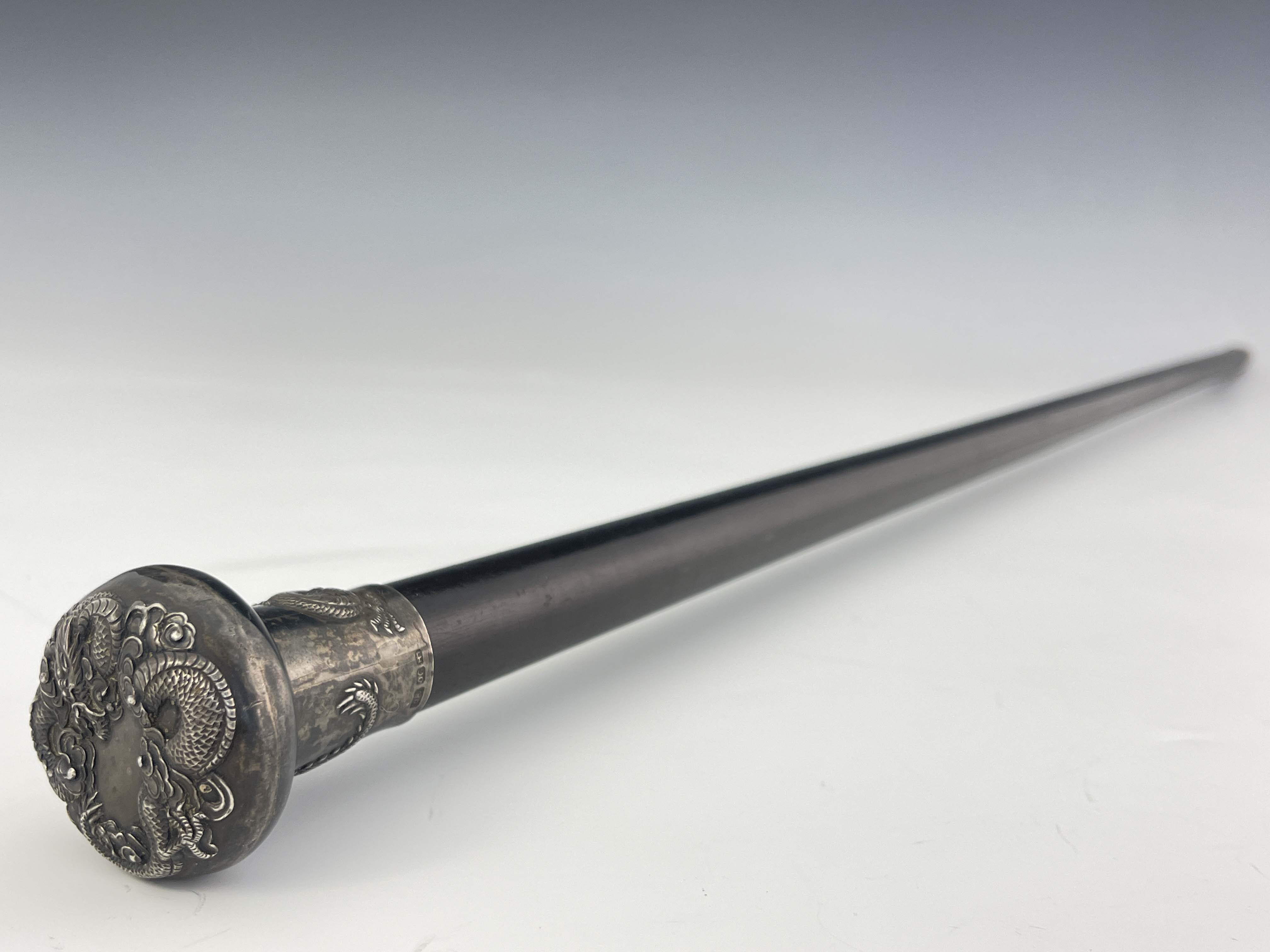 A Chinese export silver knopped cane, circa 1900, pommel head embossed in high relief with - Image 3 of 3