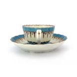 A Worcester enamelled and gilded tea cup and saucer