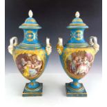 A pair of Sevres style covered twin handled baluster vases, mid 19th Century, pineapple finials to