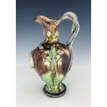 A 19th century Portuguese Palissy ware ewer, pedestal urn form, Maiolica glazed and relief moulded