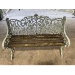 A Victorian cast iron garden bench, in the manner of Coalbrookdale, fruiting vine design,