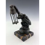 Max Le Verrier, Boubou, an Art Deco patinated art metal figural lamp or car mascot