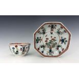 A Worcester polychrome tea bowl and saucer