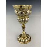 A 17th century German silver gilt chalice cup, HDS, Augsburg circa 1620, the ogee bowl embossed in