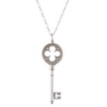 Tiffany & Co., an 18ct gold diamond Quatrefoil Key pendant, with chain
