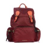 Burberry, a red nylon backpack