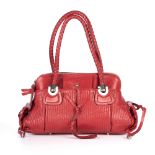 Chloe, a red patent leather handbag