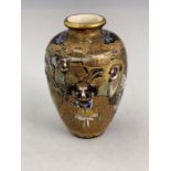 A Japanese satsuma ware baluster vase, Meiji period, 1868-1912, profusely decorated with raised