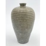 A Chinese meiping vase, of ribbed form with a matt grey crackle glaze, 24cm high