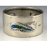 Archibald Knox for Liberty and Co., an Arts and Crafts silver and enamelled napkin ring, Birmingham