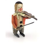 A Schuco clockwork clown violinist, 11cm high, (key)