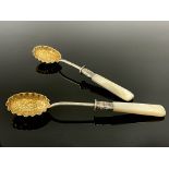 A pair of Victorian silver gilt and mother of pearl fruit spoons, Lee and Wigfull, Sheffield 1897