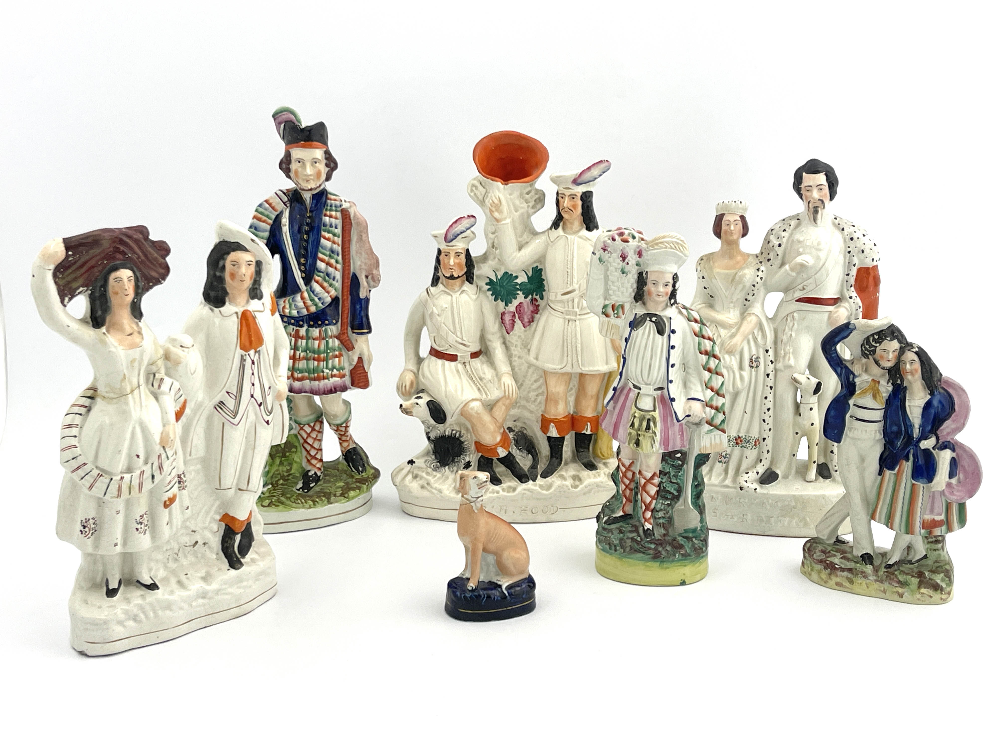 Seven assorted 19th Century Staffordshire pottery flatback and other figures, to include Robin