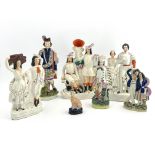 Seven assorted 19th Century Staffordshire pottery flatback and other figures, to include Robin
