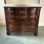 An early George III mahogany serpentine chest of drawers, circa 1770, ogee moulded top over a