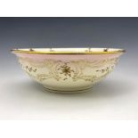 A Minton raised paste gilt and relief moulded blush ivorine bowl