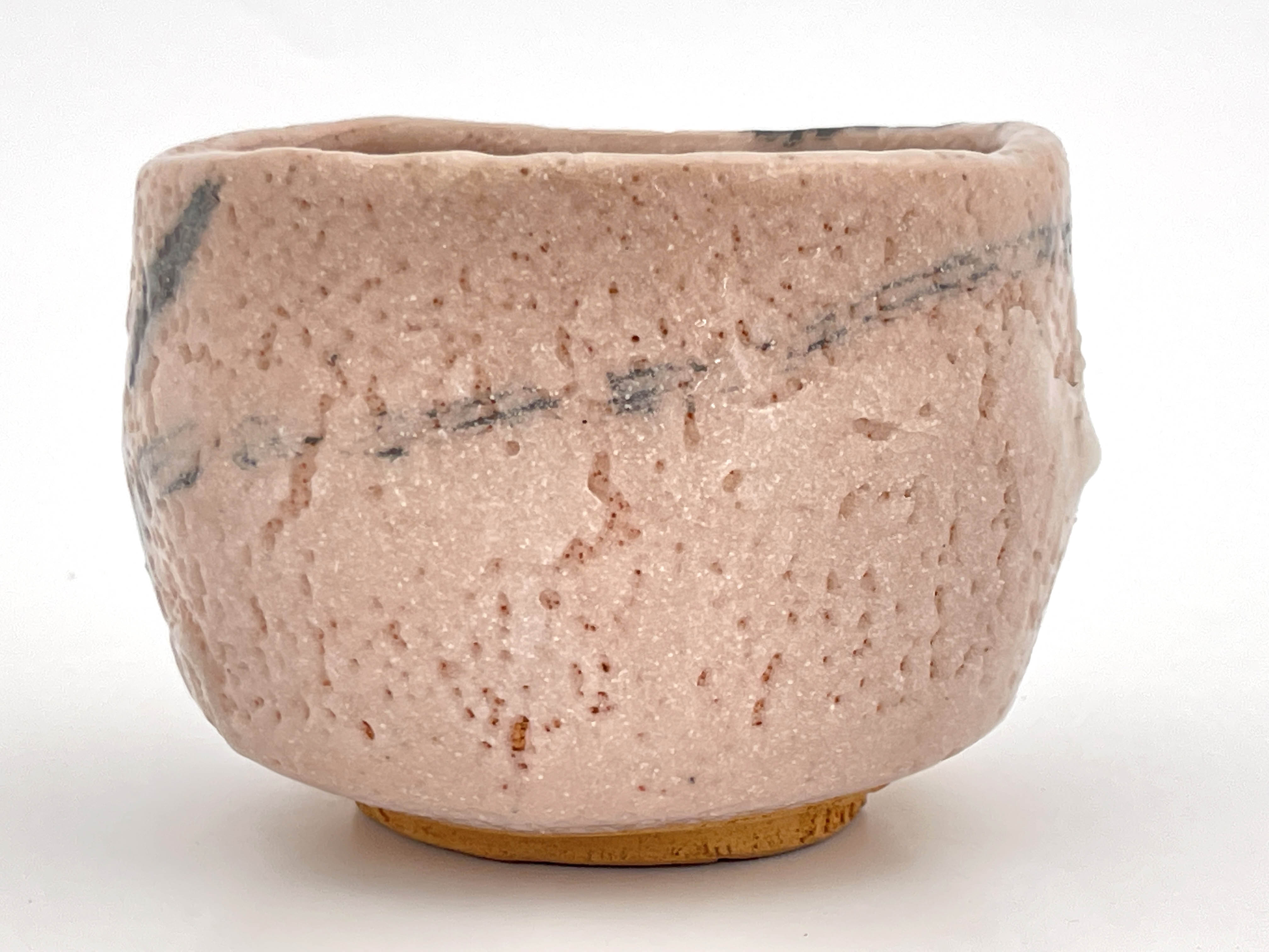 A Japanese Shino ware tea bowl, pitted cream glaze with brush work motifs, incised marks, 12cm wide - Image 2 of 5