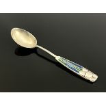 Archibald Knox for Liberty and Co., an Arts and Crafts silver and enamelled Decos teaspoon,