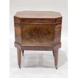 A George III flame mahogany cellarette, circa 1790, octagonal with brass ring side handles, division