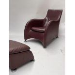 Matthew Hilton for Montis, a 'Balzac' burgundy leather armchair and footstool, aluminium disc