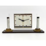 Leon-Hotot for ATO, an Art Deco chrome and maccassar clock, the plain glass rectangular face flanked
