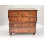 A 19th Century mahogany campaign chest of drawers, in two sections with side handles, two short over