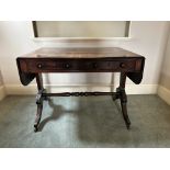 A Regency mahogany sofa table, circa 1820, rounded rectangular hinged end flaps, twin frieze drawers
