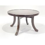 A coffee table, circa 1930's, circular mottled brown bakelite top, outswept wooden legs, 37cm