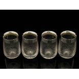 Christpher Dresser for Hukin and Heath, a set of four Aesthetic Movement silver mounted glass toddy