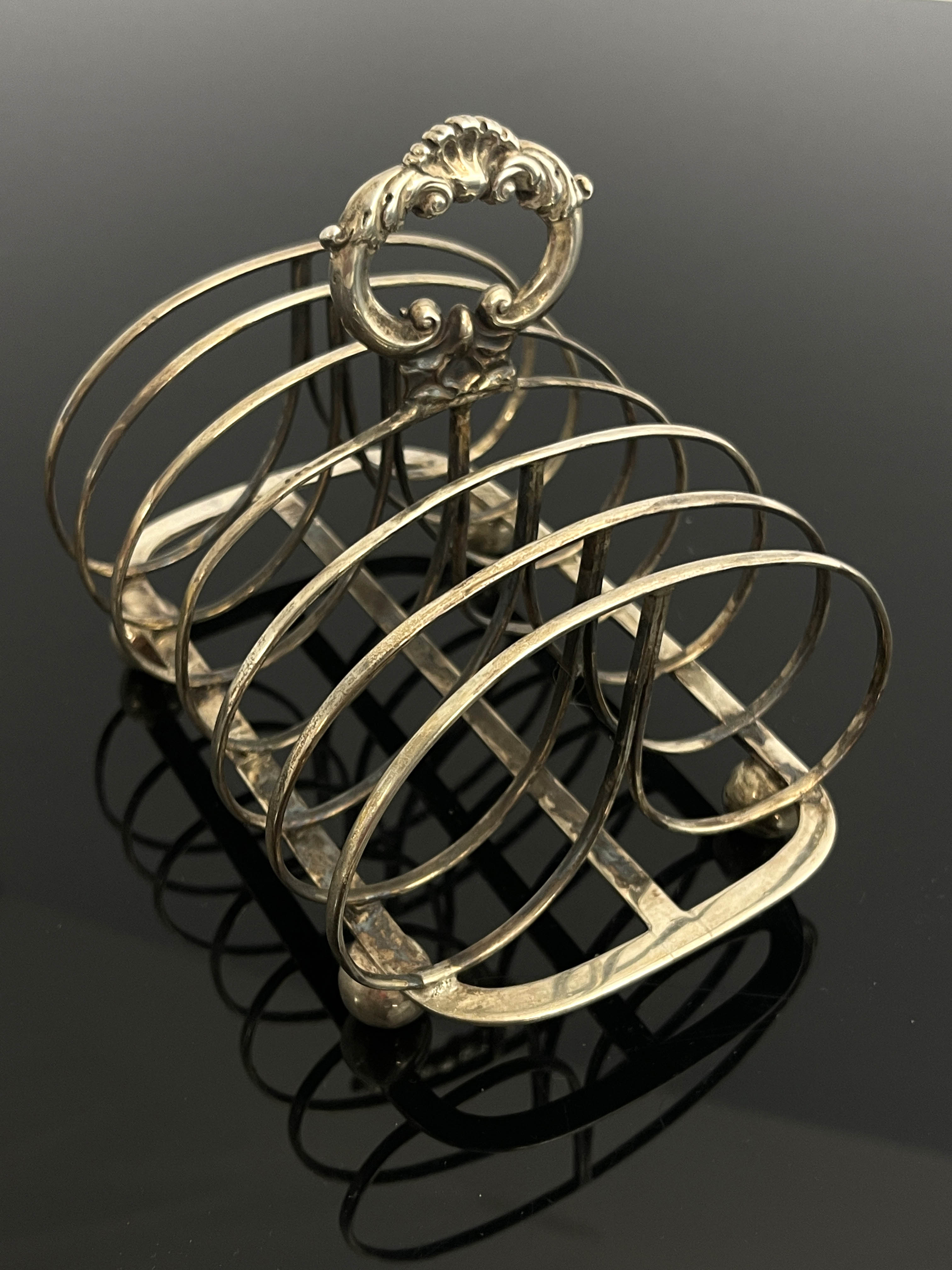 A George IV silver toast rack, London 1829, six se