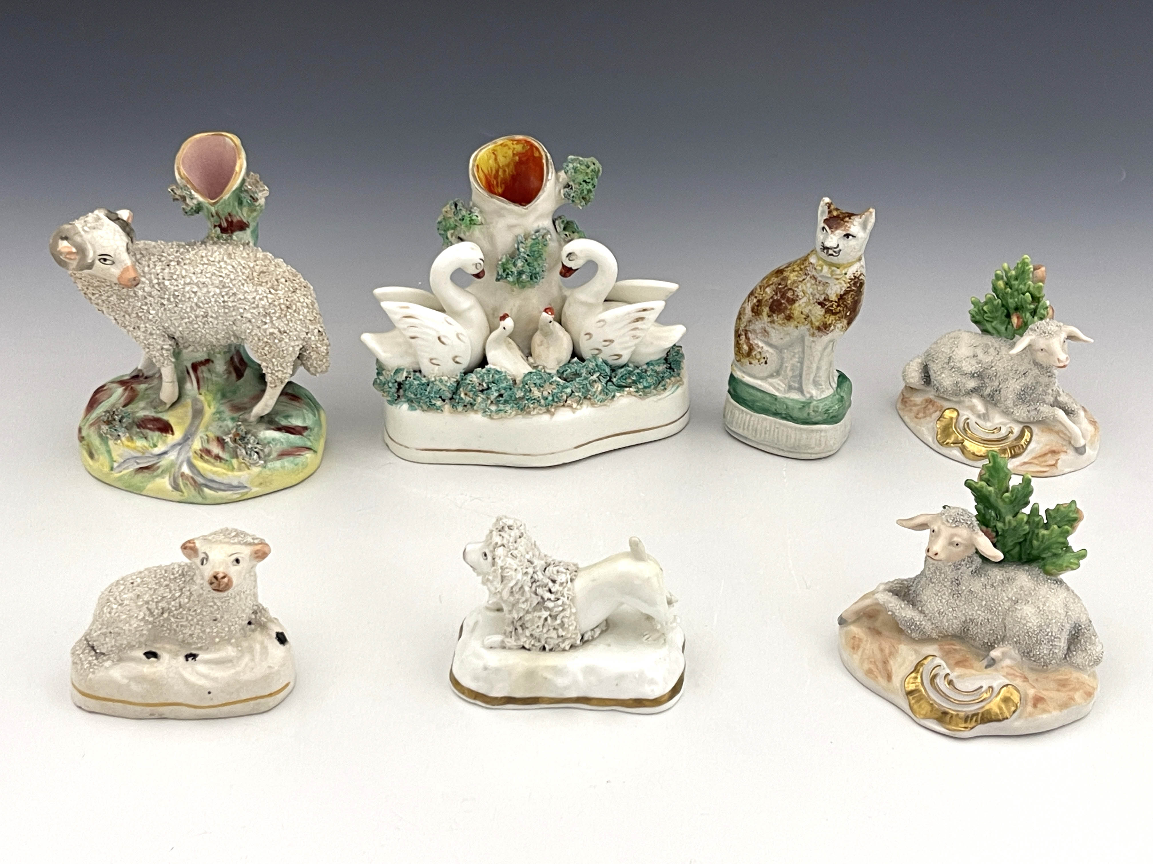 A group of 19th Century and later Staffordshire pottery and other porcelain animal figures, to