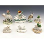 A group of 19th Century and later Staffordshire pottery and other porcelain animal figures, to