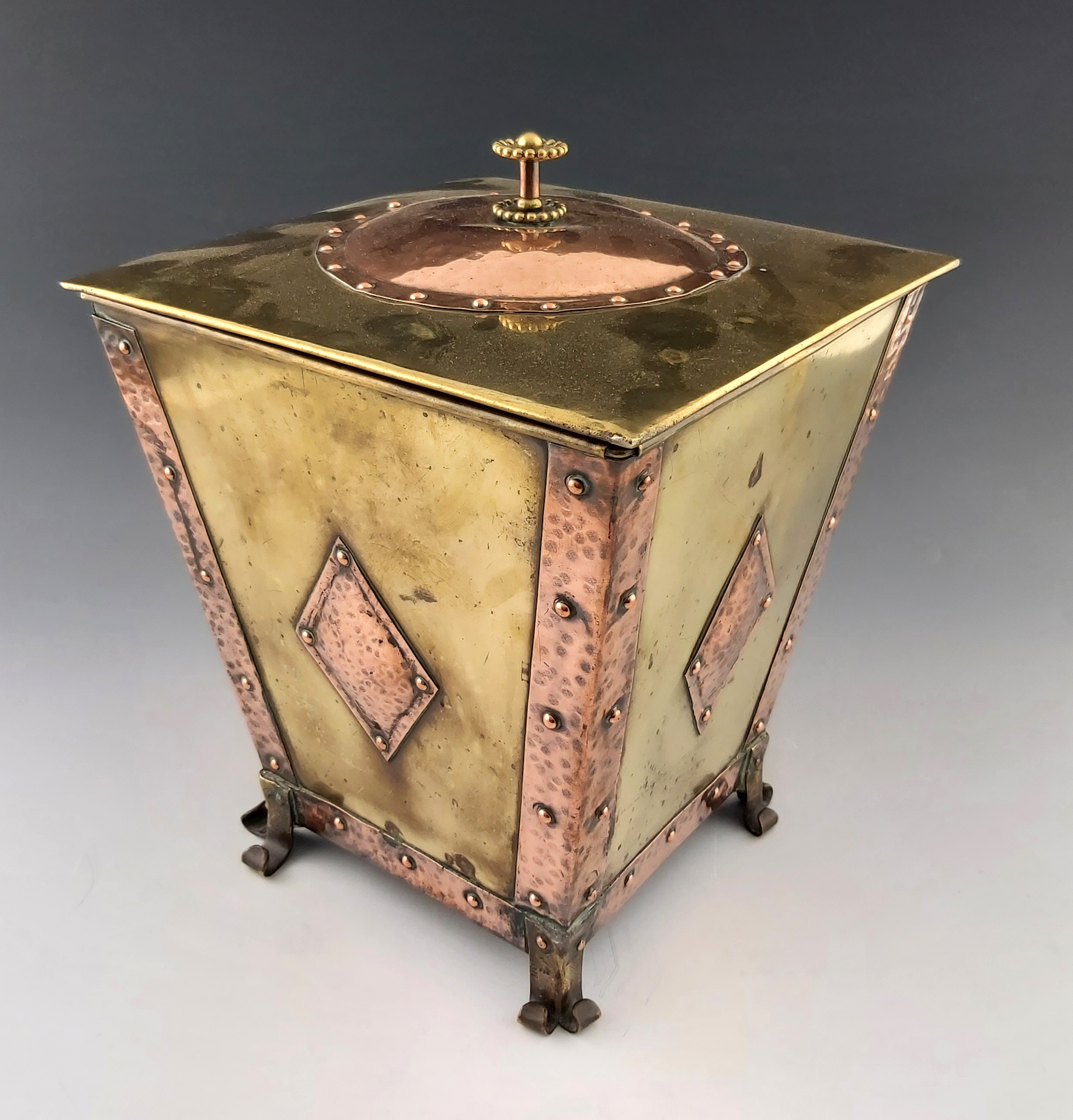 An Arts and Crafts copper and brass coal box