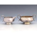 A George V silver sugar bowl and jug, Deykin and Harrison, London 1932