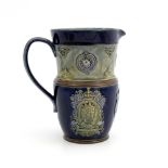 A Royal Doulton stoneware commemorative jug, circa 1911, applied with relief moulded roundels of